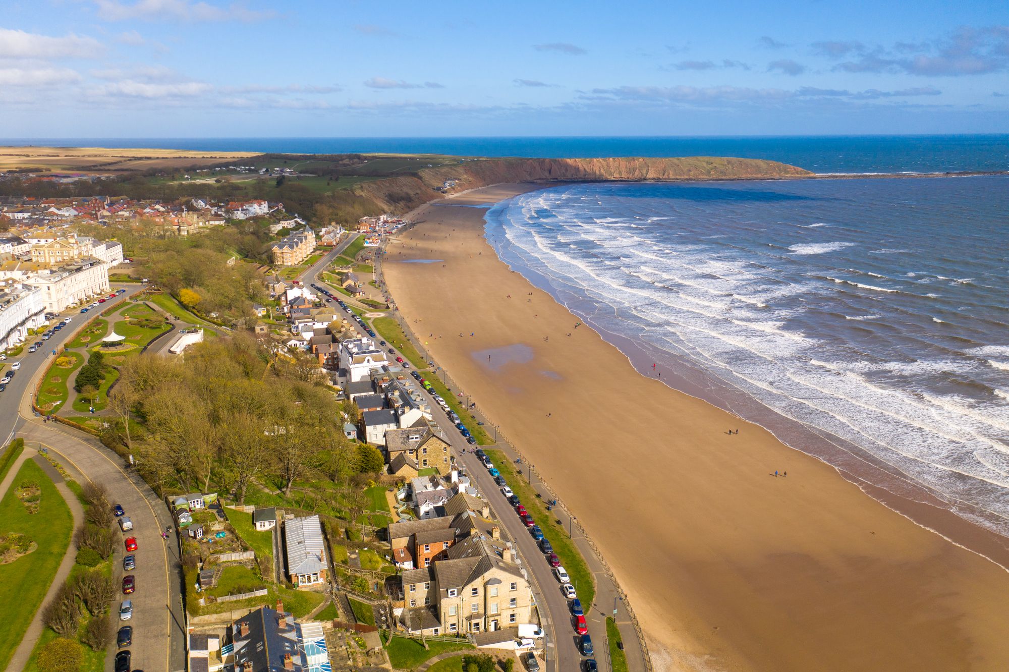 An aerial view of Filey beach and Filey Brigg