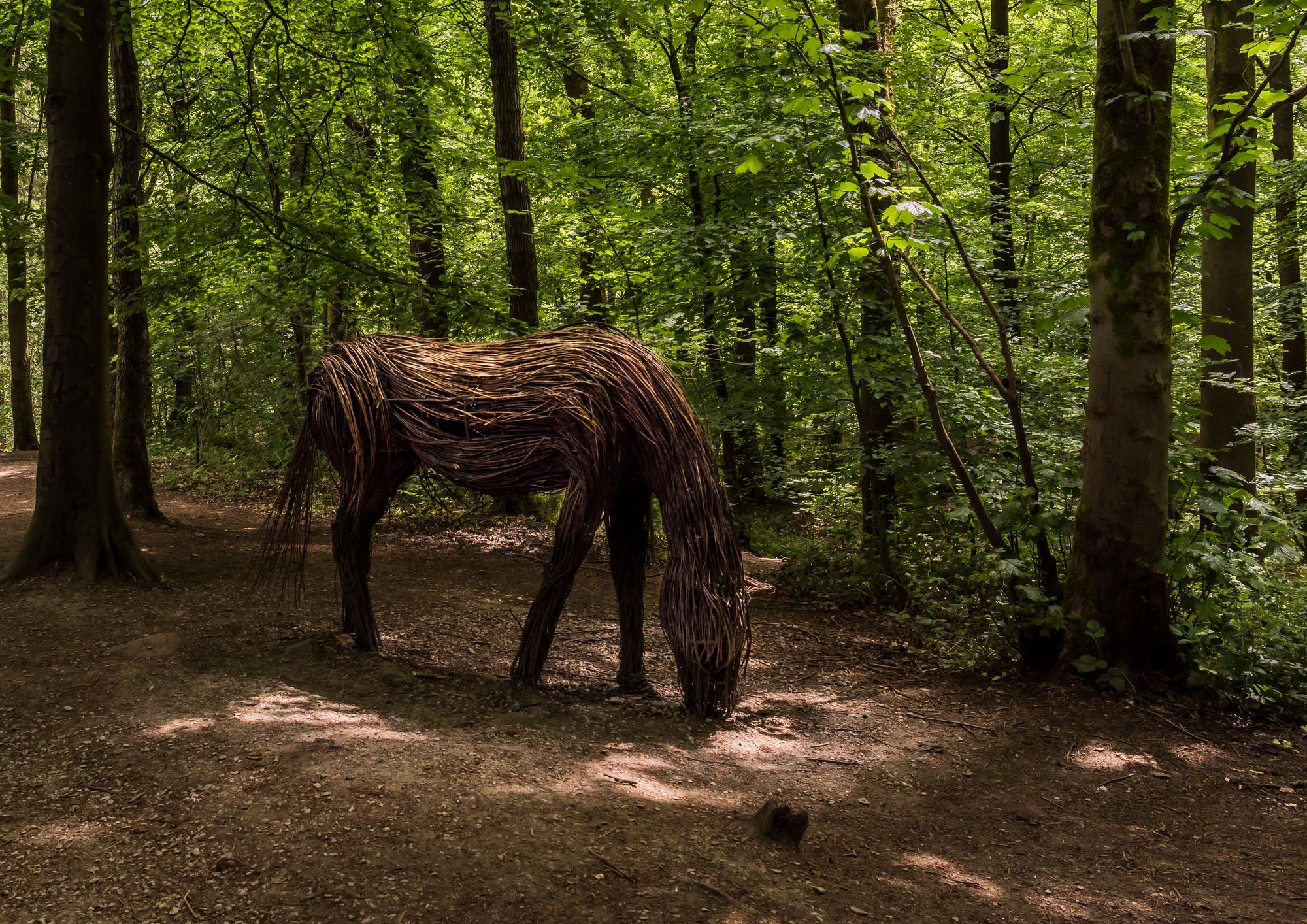 Full-size sculpture of a horse, made from wood